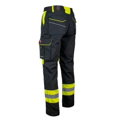 A pair of black and yellow work pants shown from the back.