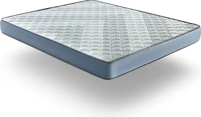 A mattress floating above a white surface with a shadow underneath.