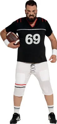 A man dressed as an American football player holding a football.