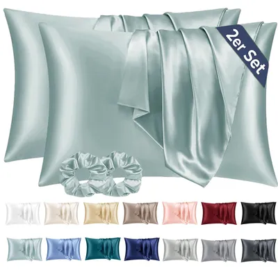 Produktbild von Set mit 2 Satin-Kissenbezügen, 40 x 80 cm, grün, seidenweich und pflegeleichter als Seidenkissenbezüge. Inklusive 2 Haargummis.
