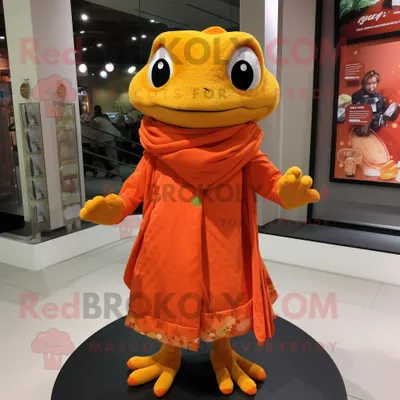 Produktbild von Orangefarbener REDBROKOLY Frosch Maskottchen Kostüm charakter bekleidet mit einem Wickelkleid und Schalnadeln