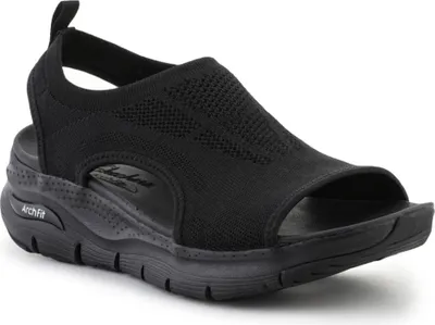 A studio shot of a single black sandal.