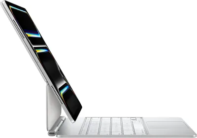 A silver iPad Pro with a Magic Keyboard attached, shown in a side profile against a white background.