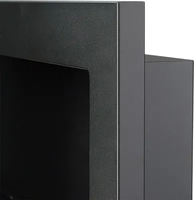 A close-up view of the corner of a black, matte-finished fireplace.