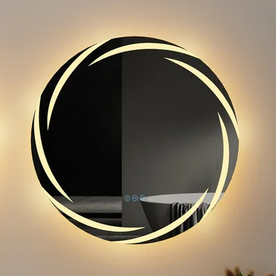 A round LED mirror with a streamer design, mounted on a wall.