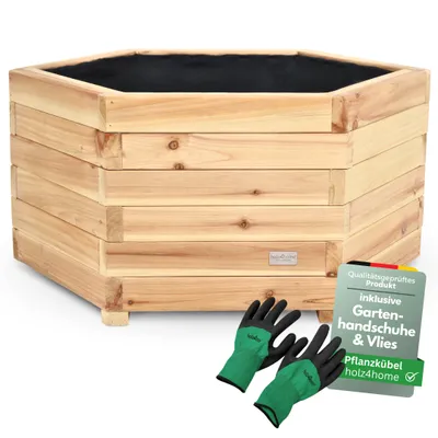 A hexagonal wooden planter box with a black liner, shown with a pair of green gardening gloves and a small informational sign.