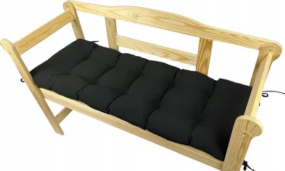 A wooden garden bench with a black cushion.