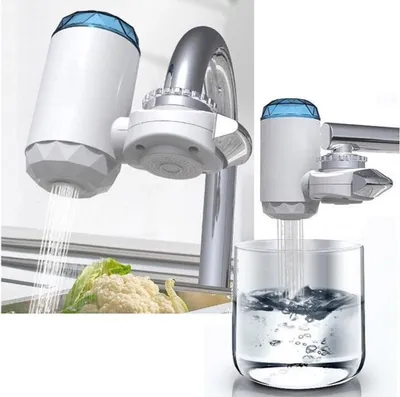 A faucet water filter is shown attached to a faucet, with water flowing into a sink with vegetables and into a glass.