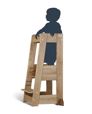 A wooden learning tower with a silhouette of a child on it.
