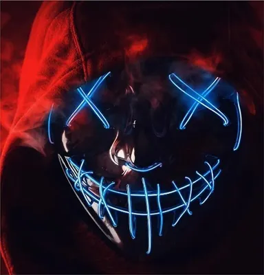 A close-up of a person wearing a red hoodie and a glowing blue LED purge mask.