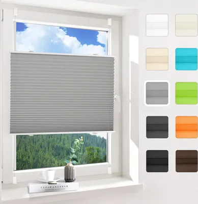 A window with a gray pleated blind covering the lower part, showing a forest view outside. To the right, a collage of color swatches for the blinds.