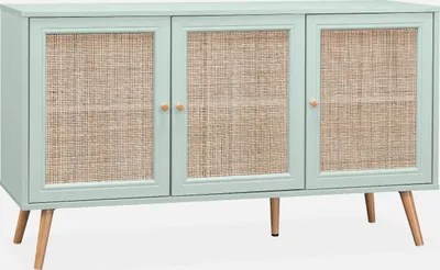 A light green sideboard with rattan-effect doors and wooden legs.
