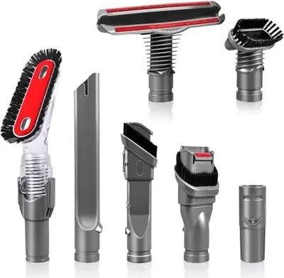 A collection of vacuum cleaner attachments arranged on a white background.