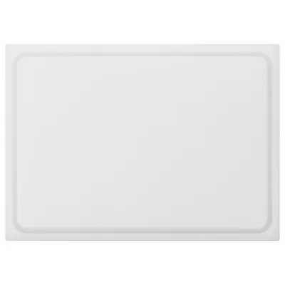A white rectangular cutting board with a raised edge.