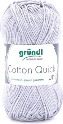 A ball of grey yarn with a label.
