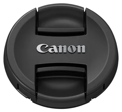 A black Canon lens cap with the Canon logo in silver.