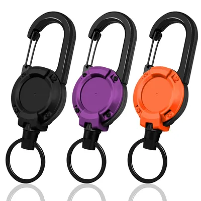 Produktbild von Ausziehbares Schlüsselanhänger-Set (3-teilig) - Ausziehbarer Auswelter mit 60 cm Stahlseil und Karabiner (schwarz, lila, orange)
