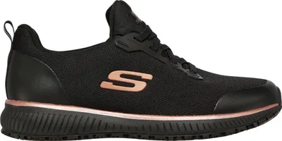 A side view of a black Skechers sneaker with rose gold accents.