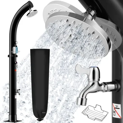 A black outdoor shower with water spraying from the showerhead and a black protective cover.