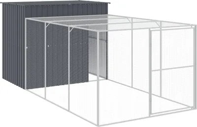 A dark gray metal shed attached to a large wire mesh enclosure.