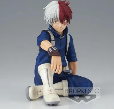 A figurine of Shoto Todoroki from My Hero Academia, posed sitting down.