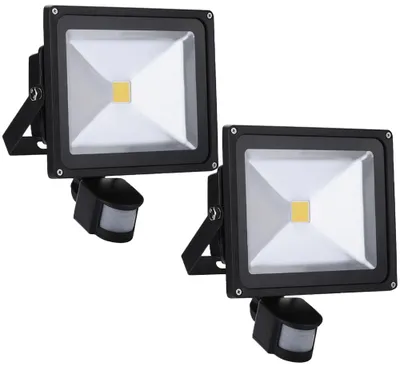 Two black LED floodlights with motion sensors are shown against a white background.