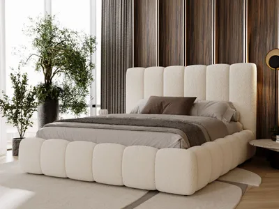 A modern bedroom with a large bed, plants, and decorative wall panels.