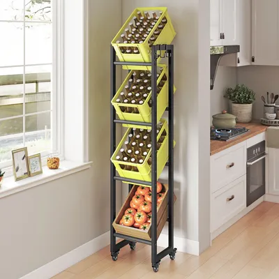 A narrow metal shelving unit with four tiers, holding yellow crates filled with bottles and a wooden crate with tomatoes, placed in a kitchen setting near a window.
