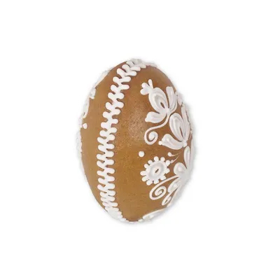 A single gingerbread cookie shaped like an egg, decorated with white icing.