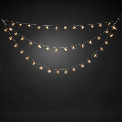 Obrázek produktu pro Konstsmide LED světelný závěs, 44 čirých sněhových vloček, 44 teplých bílých diod, 4,5 V, venkovní (IP44), průhledný kabel - 4042-103