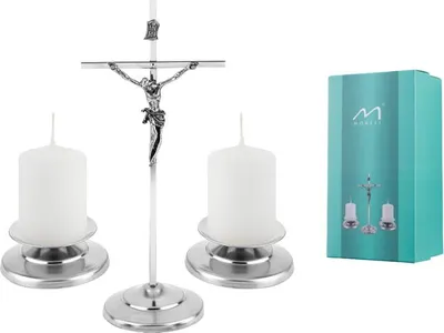 A product shot of a crucifix with two candles and its packaging.