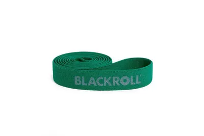 A green resistance band rolled up on a white background.