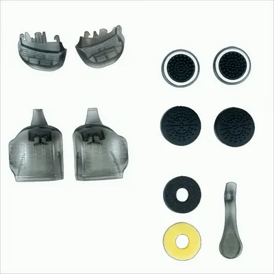 A collection of gaming controller accessories laid out on a white background.