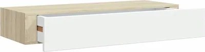 A floating shelf with one drawer partially open, against a white background.