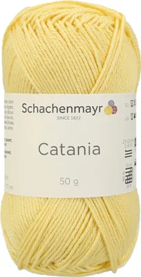 A ball of yellow yarn with a label.