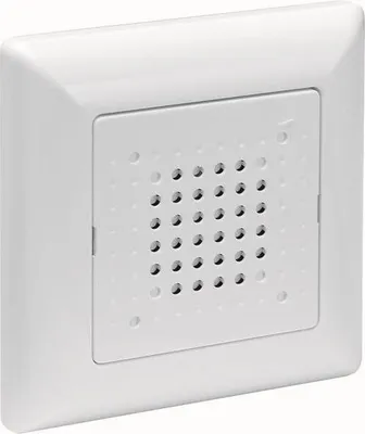 A white wall-mounted electrical component with a perforated grille.