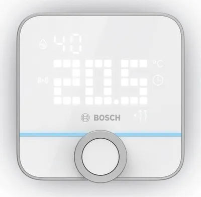 A white digital thermostat with a gray dial and a blue accent line.