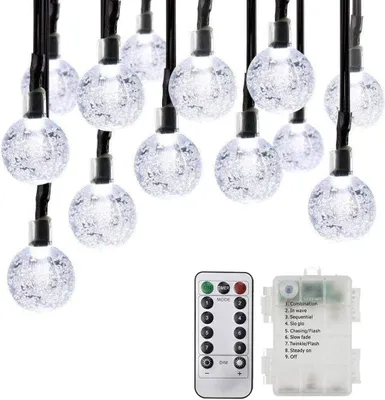 A string of solar-powered LED lights with a remote control and battery pack.