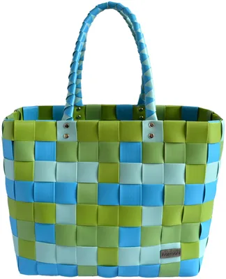 A woven shopping basket with blue and green squares.