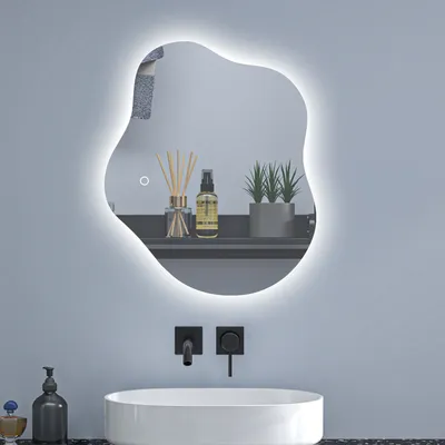 A modern bathroom vanity with a sink, faucet, and a uniquely shaped illuminated mirror.