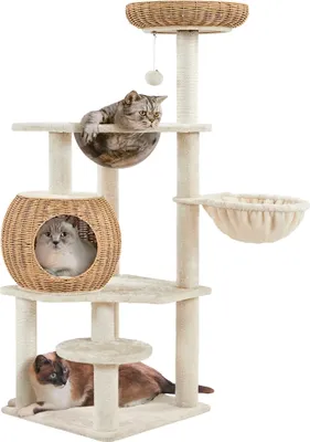 A multi-level cat tree with various platforms, a basket, and enclosed spaces, occupied by three cats.