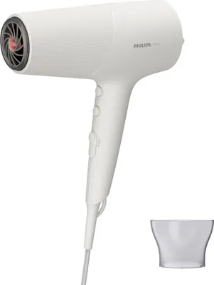 A white Philips hair dryer is shown on a white background, with a detachable nozzle accessory placed to the side.