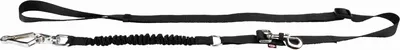 A black dog leash with a bungee cord section and metal clips, laid out on a white background.