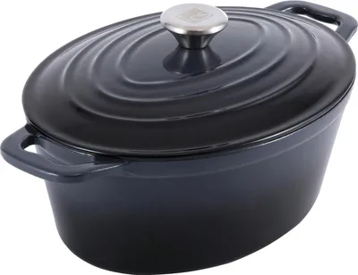 A dark gray oval cast iron pot with a silver lid handle, shown from a slightly elevated side angle on a white background.