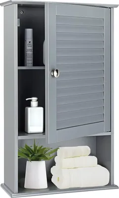A gray bathroom cabinet with a louvered door, showing stored items like toiletries and towels.