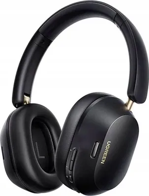 A pair of black over-ear headphones with gold accents, shown against a white background.