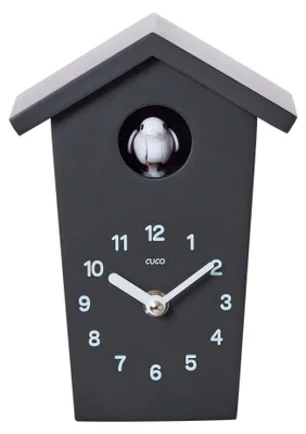 A black cuckoo clock with a white bird and white clock hands and numbers.