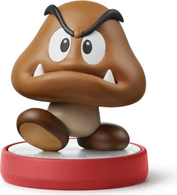 A Goomba Amiibo figure from the Super Mario series is displayed on a red base.