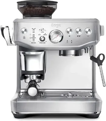 A front-facing studio shot of a silver espresso machine with a bean hopper on top.
