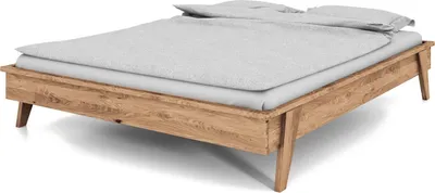 Produktbild von Bett Jetro aus Wildeiche massiv bianco 90x200 cm ohne Kopfteil mit Holzbeinen